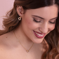Golden Pendant Earrings with Double Pavé Heart Element and Oval Link